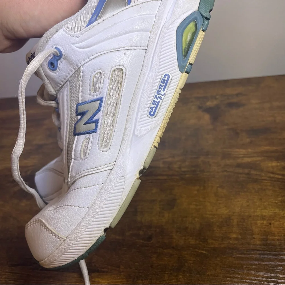 New Balance White Athletic Sneakers with Blue Accents
